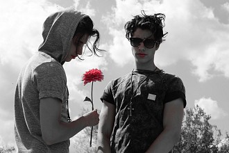 two boys and one flower